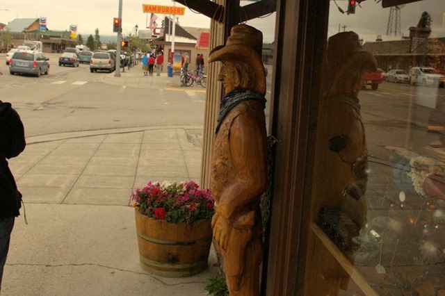 carved wood cowboy sculpture, West Yellowstone, Montana, August 20, 2014