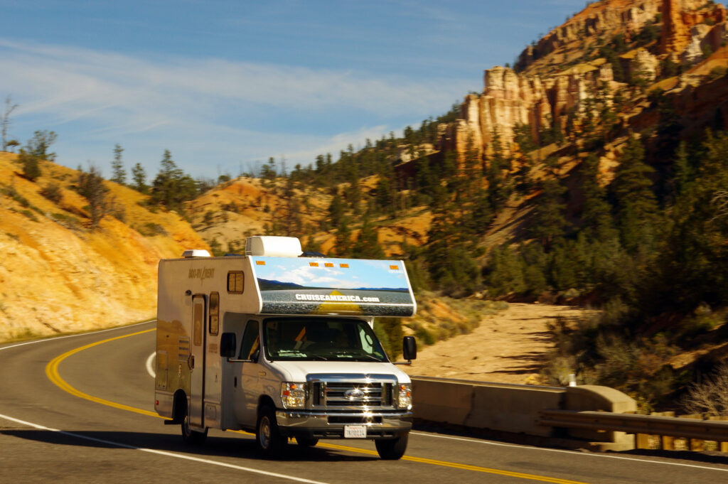 Rental Class C motorhome pulling in at Mossy Cave trailhead parking lot, Bryce Canyon National Park, Utah, October 8, 2015